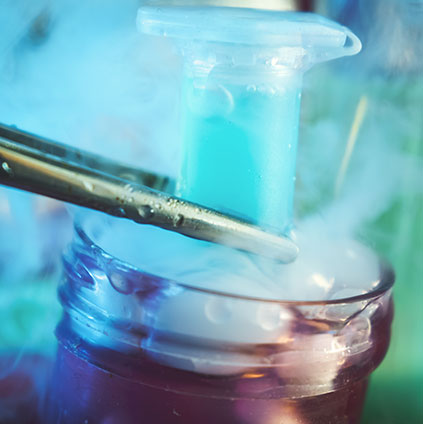 Close-up of cryogenic storage process showing laboratory liquid nitrogen tube used for egg freezing in fertility preservation